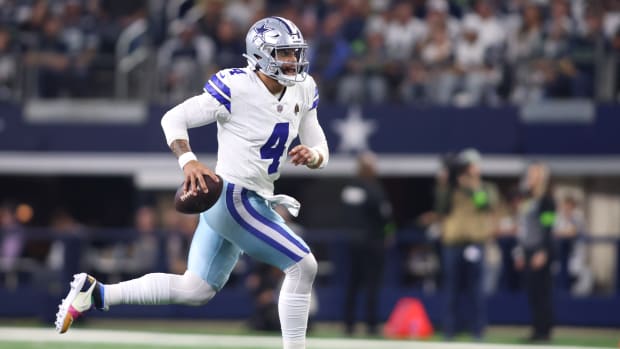 Dallas Cowboys quarterback Dak Prescott runs with the ball against the Seattle Seahawks.
